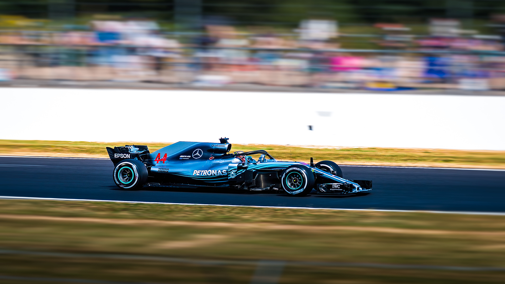 unsplash-logoCarl Jorgensen Lewis Hamilton driving the Mercedes AMG F1 W09 EQ Power  in 2018 at Silverstone. Hamilton has been repeatedly linked with the Scuderia since he met Ferrari chairman John Elkann at a social event in 2019, but he has recently publicised his commitment to Mercedes as a rebuttal to the rumours.