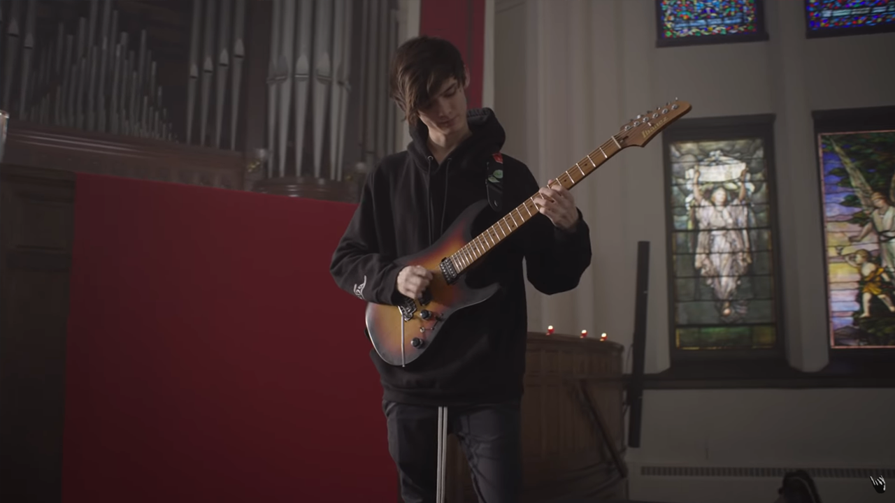 Tim Henson in the music video for Polyphia's G.O.A.T.
